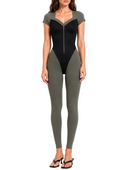 Model wearing the Dorvelle Khaki & Black Leather luxury women's jumpsuit by AP Collection